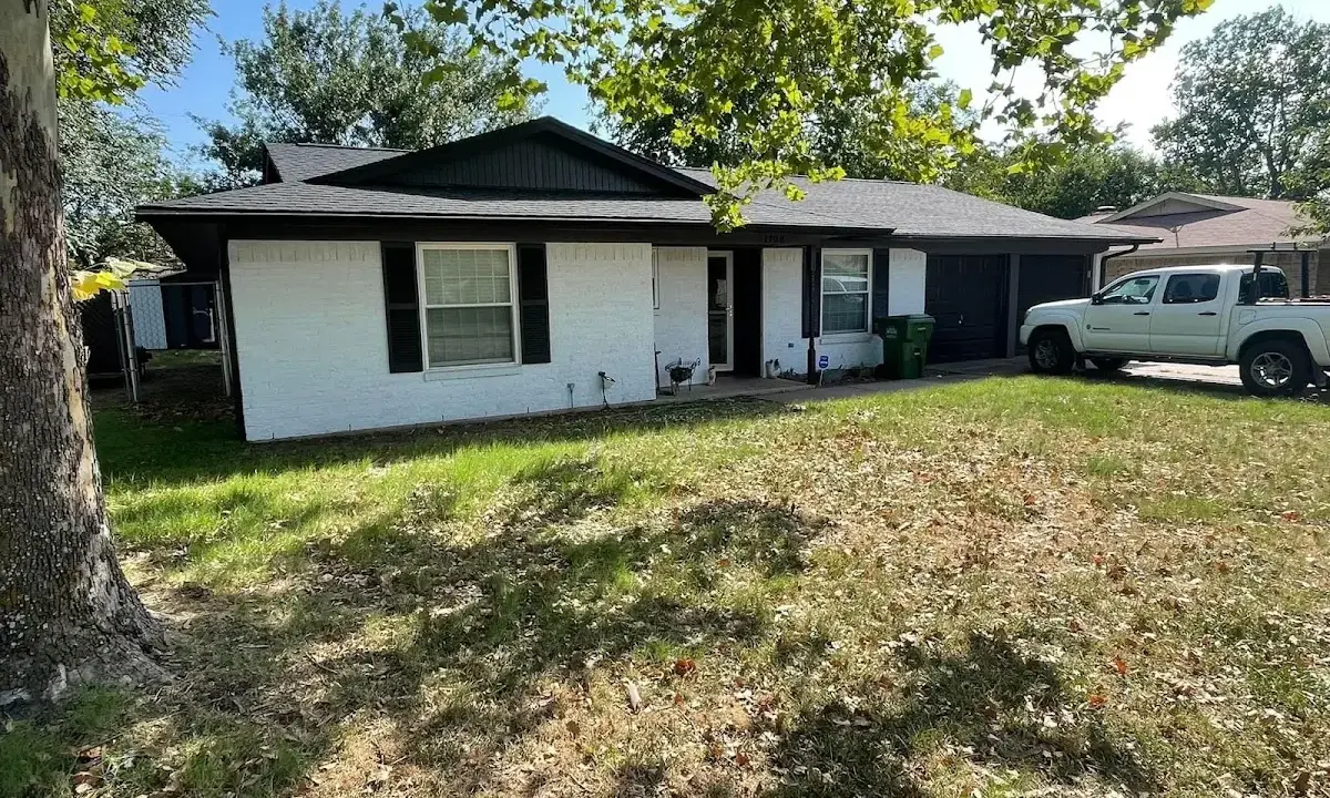 Professional roofing crew working on a residential roof in Riverside